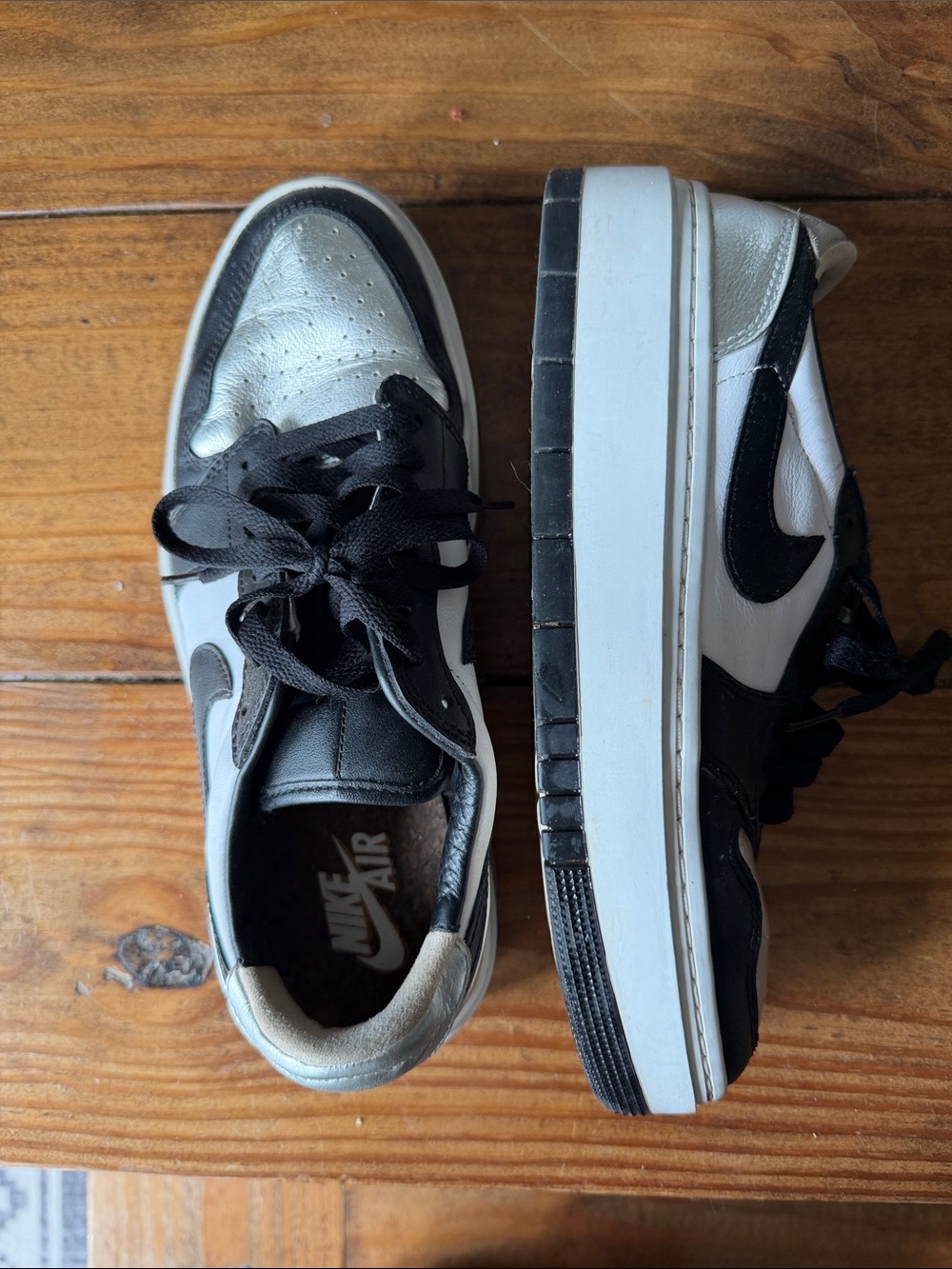 Nike women’s Jordan Black and White Low-Top Sneakers platform